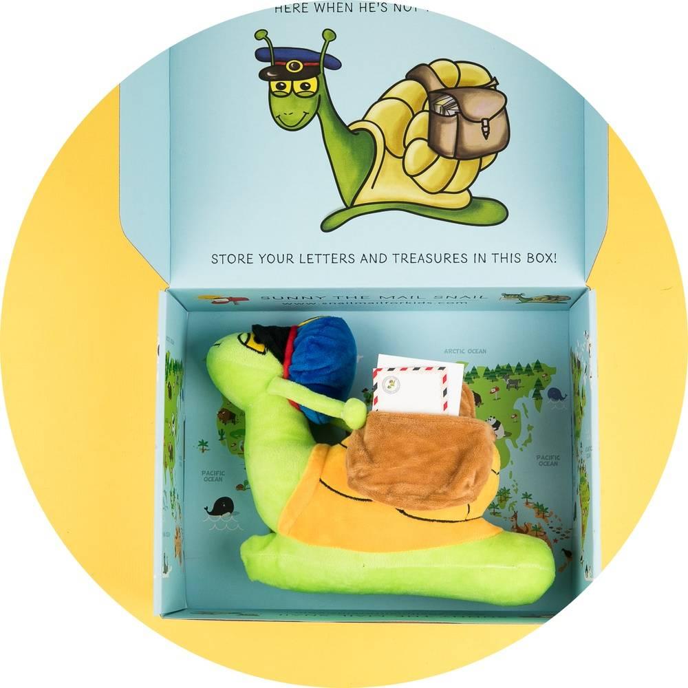 Sunny the Mail Snail stuffed animal in a colorful keepsake box